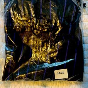 Brand new (still sealed in bag) Black and purple stripe baseball pants.